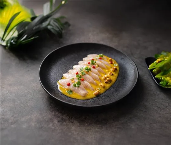 A chef plating paiche